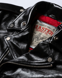 Close-up of the Master Supply Co. brand label and collar of the black leather jacket.