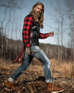 Spizoiky Wearing Master Supply Co Black Piston Vest blue jeans and plaid shirt